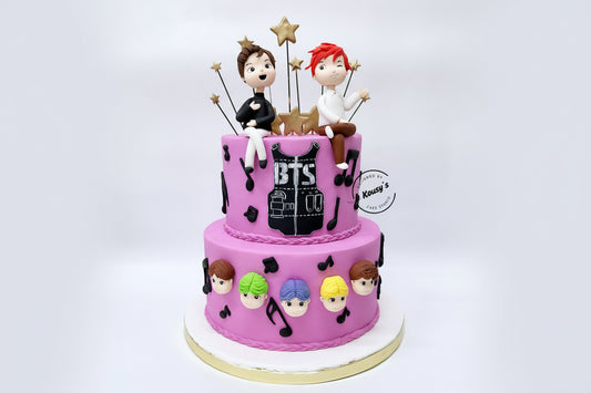 Two-tier cake with BTS-themed decorations made by Kousy's Cake studio