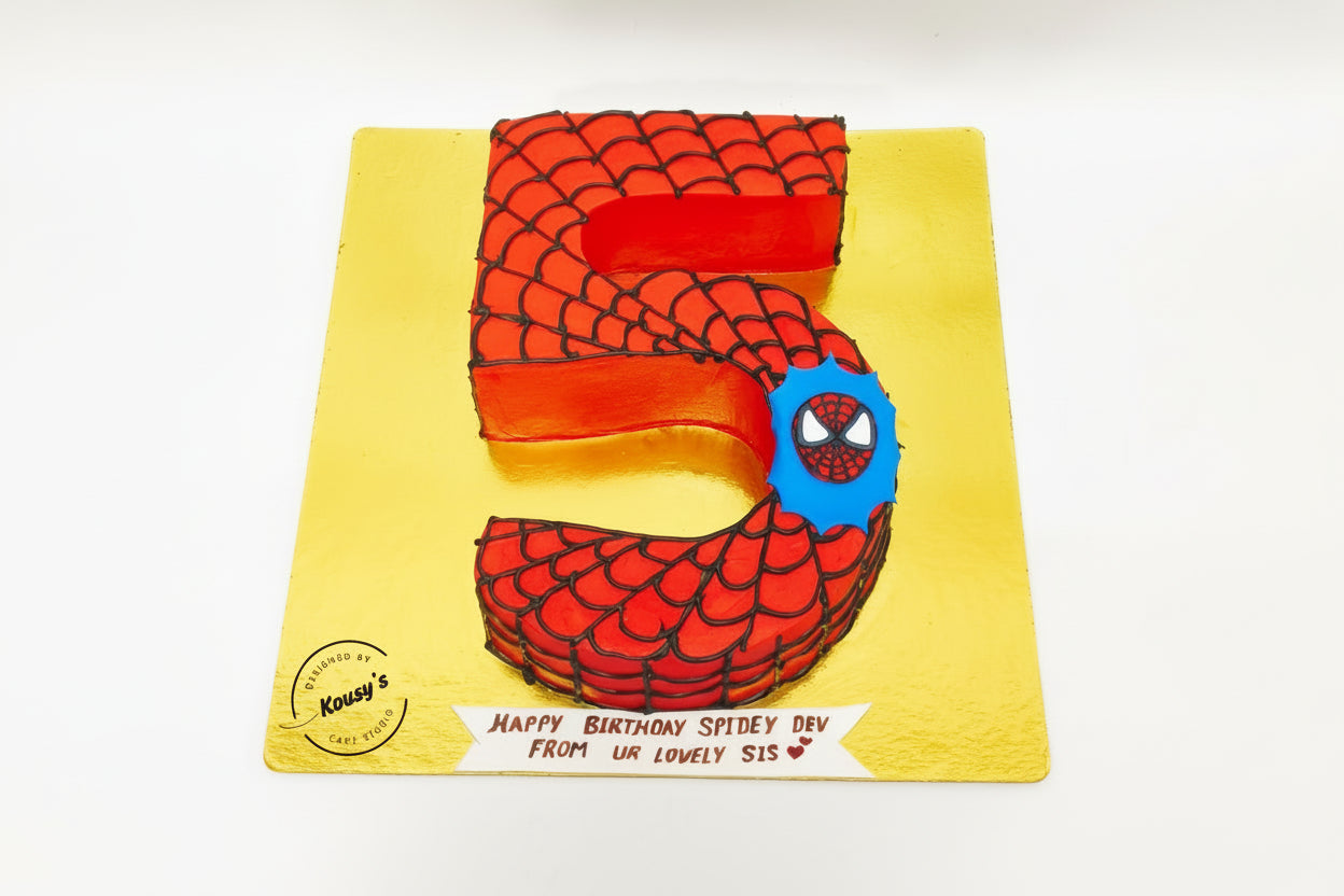 Spider-Man themed birthday cake shaped like the number 5 on a yellow background